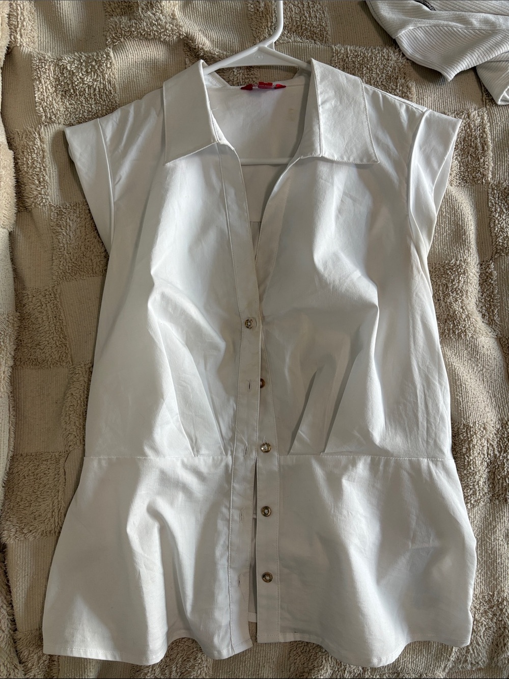 White sleeveless collared button up